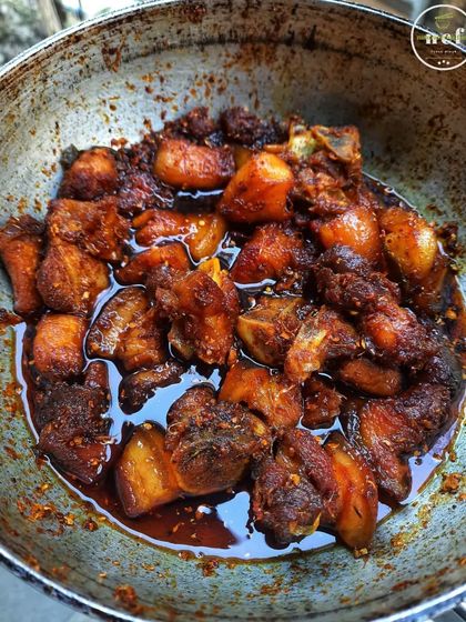 A close-up of my pork stir fry, cooked with fiery king chilies for an extra kick.