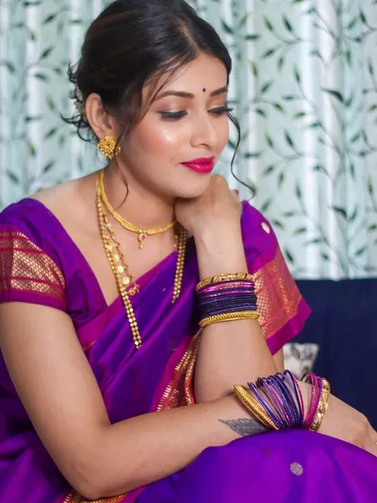 Another beautiful shot from the Paithani series, highlighting the soft glam makeup and elegant pose.
