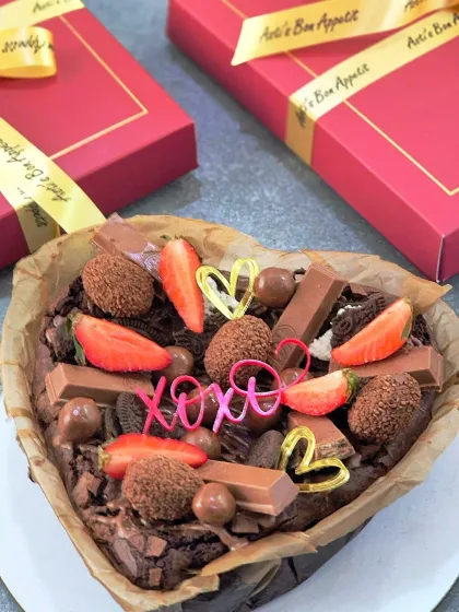 My heart-shaped brownie box, specially created for Valentine's or Galentine's Day. It's loaded with chocolates, fresh strawberries, and love, all beautifully presented in a gift box with a ribbon.