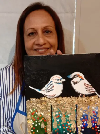 This student created a beautiful mixed-media piece, combining painting with gold leaf to depict two birds on a branch. It's a testament to her creativity.
