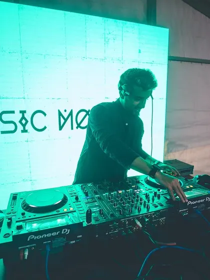 At the console during a Dandiya festival. Even with large-scale events, the focus remains on the details of the mix, blending traditional sounds with modern beats.