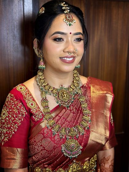 A beautiful smiling portrait of this bride, her makeup enhancing her natural radiance.