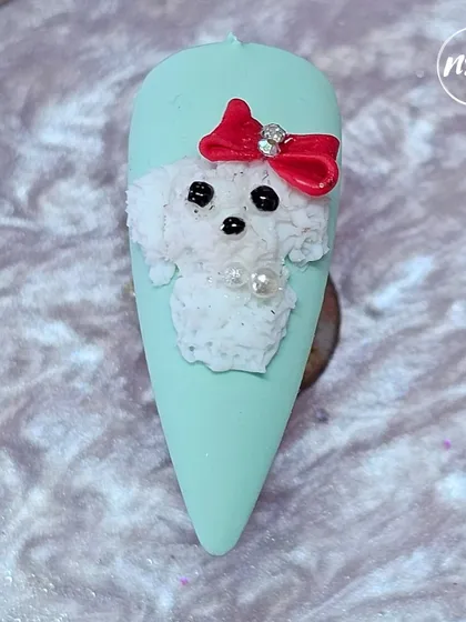 An adorable 3D fuzzy poodle nail art, showcasing the fun and whimsical side of nail design that we teach.