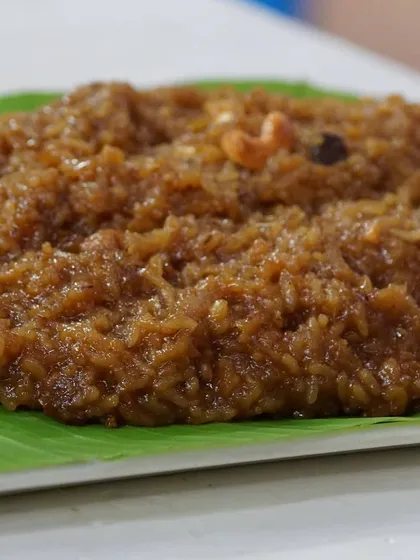 This is our traditional Sakkare Pongal, or sweet pongal, a comforting dish offered in temples and made during festivals. It is slow-cooked with rice, moong dal, jaggery, and a generous amount of ghee, then garnished with cashews and raisins.