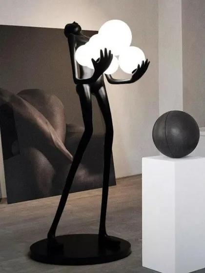 This floor lamp showcases a dynamic human form crafted from high-quality fiberglass resin, holding a trio of glowing orbs. It is a perfect example of how we merge sculpture with LED technology to create dramatic, artistic lighting.