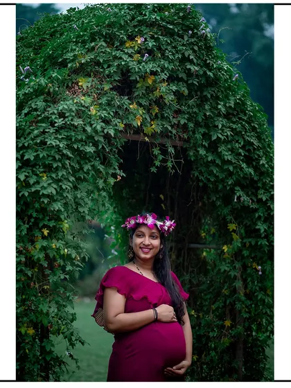 A beautiful portrait framed by a natural arch of ivy, creating a magical, secret garden feel.
