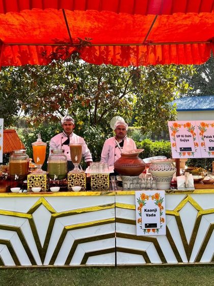 A vibrant chaat and drinks counter set up for a sunny Holi party. I offered traditional drinks like Kaanji Vada and a variety of chaats like UP ki Dahi Gujiya to celebrate the festival of colours.