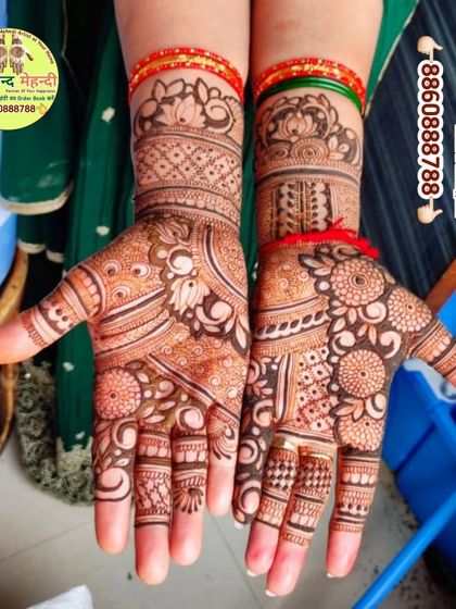 Another view of a lovely floral design, showing the detail and care put into every part of the pattern. The matching bangles add to the festive look.