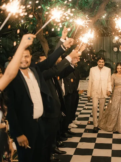 A grand entrance for the engaged couple. Friends and family create an arch of sparklers for them to walk through, making for a magical photo.
