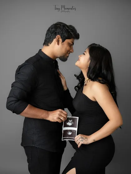 Sharing the first glimpse of your baby. Incorporating the ultrasound picture into your couple's session makes the connection to your little one feel even more real and beautiful.