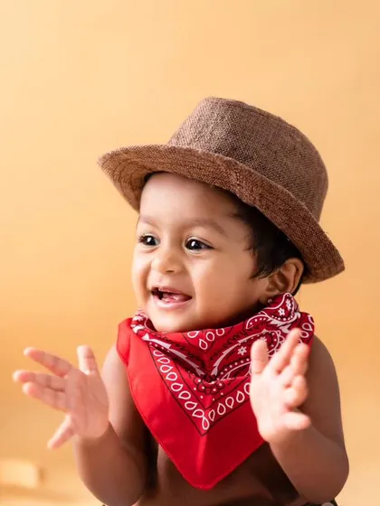 Howdy, partner! My studio is equipped for all sorts of adventures, including this fun cowboy theme. I provide the complete outfit and props to capture your little one's playful spirit.