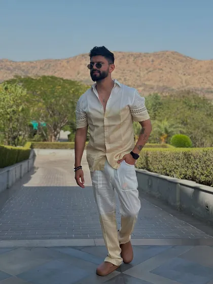 A stylish two-toned outfit, perfect for a sunny afternoon event with a beautiful mountain backdrop.