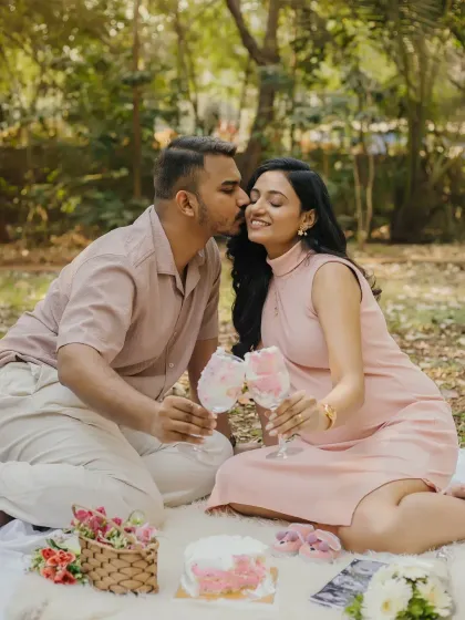Celebrating the sweet news with an outdoor picnic. These candid moments, like a gentle kiss on the cheek, are the ones you'll look back on and smile. It’s a beautiful way to announce you're expecting a girl.