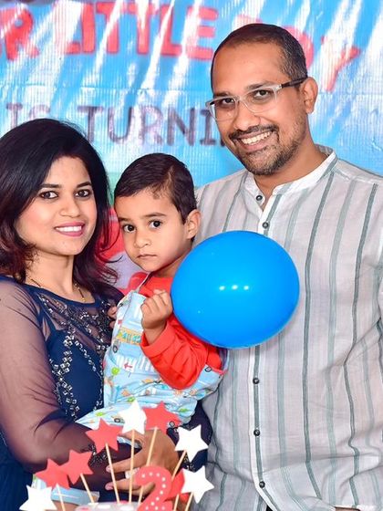 A playful 'Mickey Mouse' themed birthday party, with bright colors, character cutouts, and a fun balloon arch, creating a joyful atmosphere for little ones.