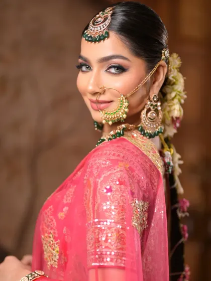 A smiling portrait that captures the bride's happiness. The makeup is designed to be radiant and photo-ready, ensuring she looks perfect from every angle.