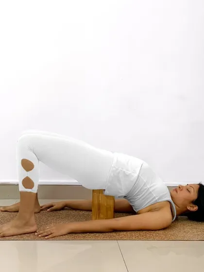 Here is a detailed breakdown of how to practice Setu Bandhasana. Using a block under your sacrum can turn this into a wonderfully restorative and supported backbend.