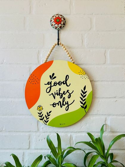 Our 'Good Vibes Only' hand-doodled wooden sign is a must-have for your entrance. The colorful design and positive message will bring a cheerful and welcoming feel to your home.