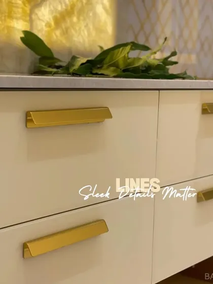 Sleek details matter. These minimalist gold cabinet handles add a touch of elegance and a clean, horizontal line to the drawer fronts.