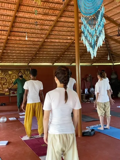 I address the class from the front of the shala. These teaching moments are opportunities to share the wisdom I have gathered over 29 years of dedicated practice.