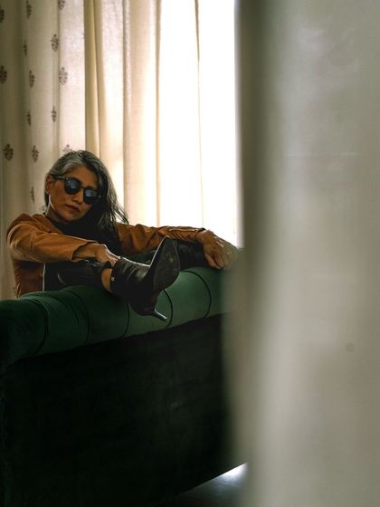 A playful shot from the rock-chic series, showing that even an edgy look can have a touch of fun.