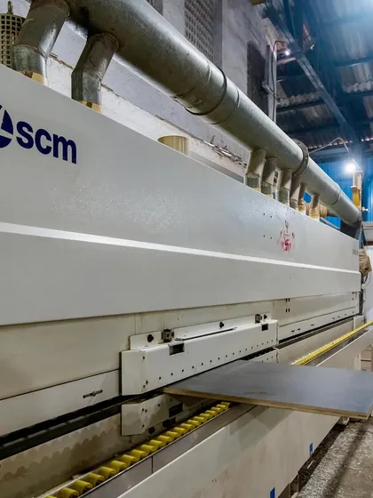 This is where precision begins. Our in-house factory is equipped with advanced machinery like this SCM edge bander, ensuring every panel for your modular furniture is finished perfectly. This level of quality control means your office interiors are built to last.