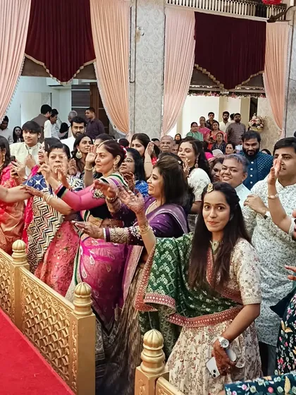 The guests fully immersed in the musical lagnageet ceremony, enjoying the symphony of love and tradition.