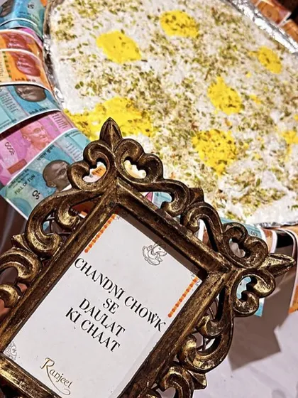 We bring theatrical flair to our food presentation. Here is our famous "Chandni Chowk Se Daulat Ki Chaat," a light, airy dessert presented with a creative touch that always delights and surprises guests.