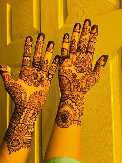 A gorgeous semi-bridal design with a mix of floral, paisley, and geometric patterns. The coverage extends to the wrist for a fuller look.