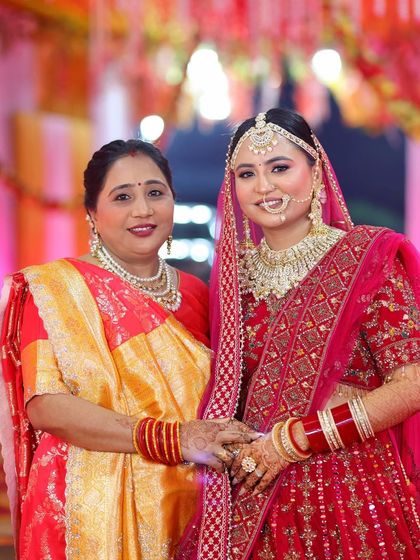 A beautiful portrait of the bride and her mother, both looking elegant and happy.