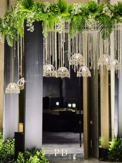 Another angle of the crystal entrance, showing how the layers of hanging crystals and chandeliers create depth and a sense of walking through a diamond waterfall.