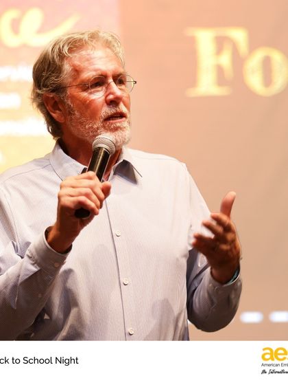 The director addresses parents at the Middle School Back to School Night, reinforcing our shared vision for student growth and success.