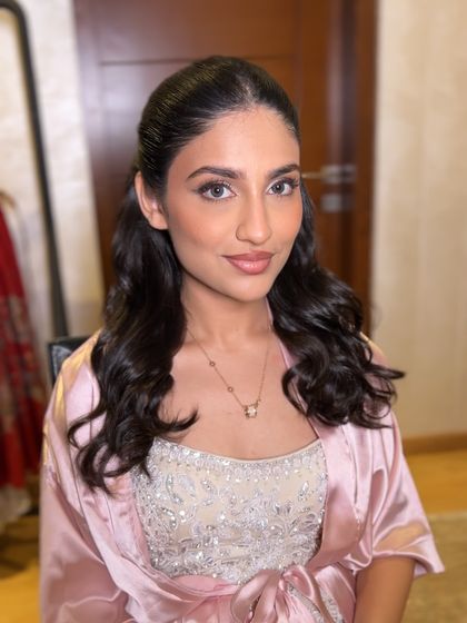 A getting-ready shot, showing the soft, natural-looking waves before the final styling.