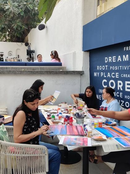 A wonderful view of my adult art class in session at a cafe. It is a great way to socialize, relax, and create together.