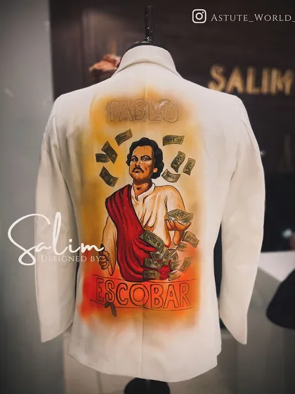 The back of a custom white blazer featuring a hand-painted portrait of Pablo Escobar. This is another example of how I can turn any concept or icon into wearable art.