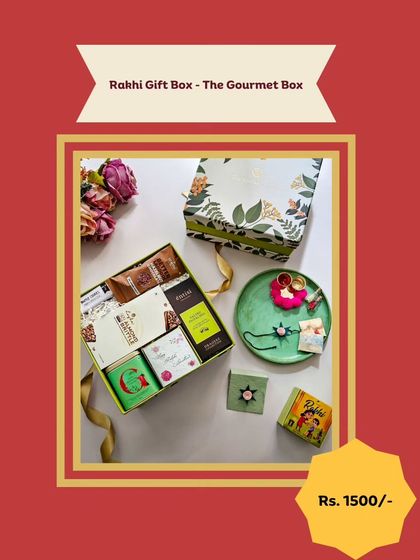 A classic Rakhi Gift Box featuring a beautiful floral design. Inside, you'll find a mix of gourmet teas, sweets, and a matching Rakhi, making it a complete and thoughtful gift.