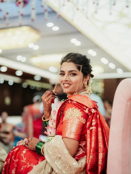 A lovely candid shot of the bride, her smile lighting up the frame.
