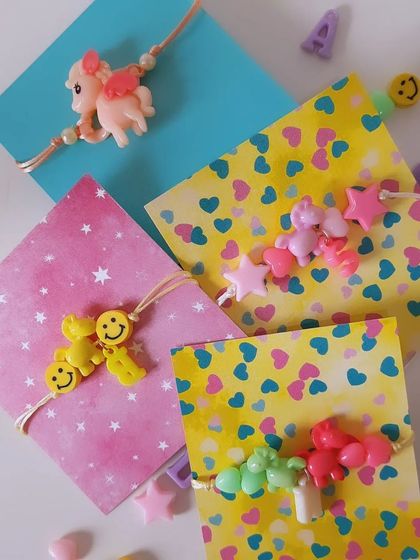 Smiles, stars, and unicorns. This collection of kids' Rakhis is all about fun and imagination, with colorful beads and playful charms that are perfect for return gifts or party favors.
