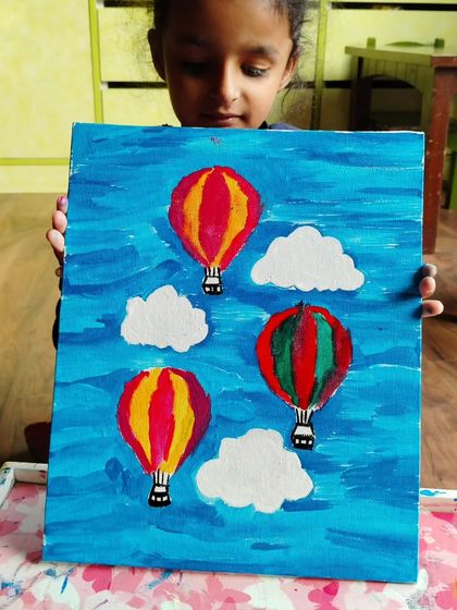 Another beautiful hot air balloon painting. I love seeing how different students interpret the same subject with their own color choices.