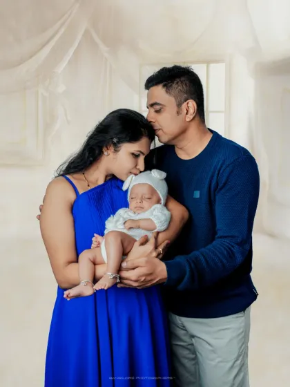 Your first family portrait. I will gently guide you into comfortable poses that feel natural, allowing me to capture the love and pride you feel as new parents.