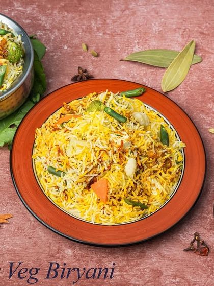 For our vegetarian guests, we offer a delicious Paneer Veg Biryani. It's made with soft paneer, fresh vegetables, and fragrant basmati rice.