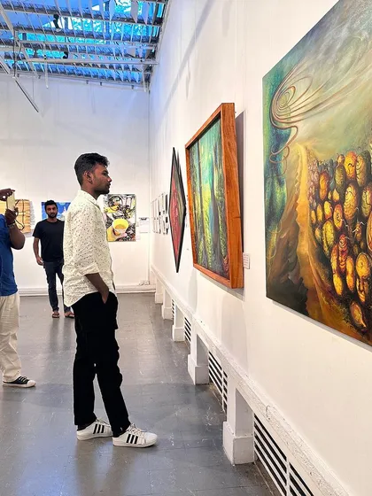 Visitors admiring the artwork at our international exhibition in Colombo.