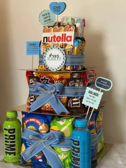 Another angle of the epic Food Tower Hamper. It's the perfect way to say "Happy Rakhi" and celebrate your bond with a mountain of their favorite treats.