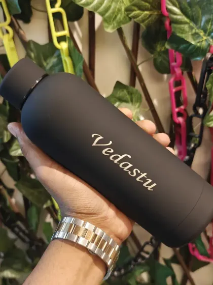 A classic matte black water bottle, personalized with a name in a script font. This is a timeless and popular choice for gifts.