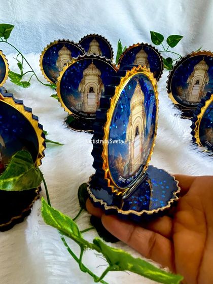 Holding one of the custom religious mementos. The size and glossy finish make it a perfect keepsake for any spiritual event.