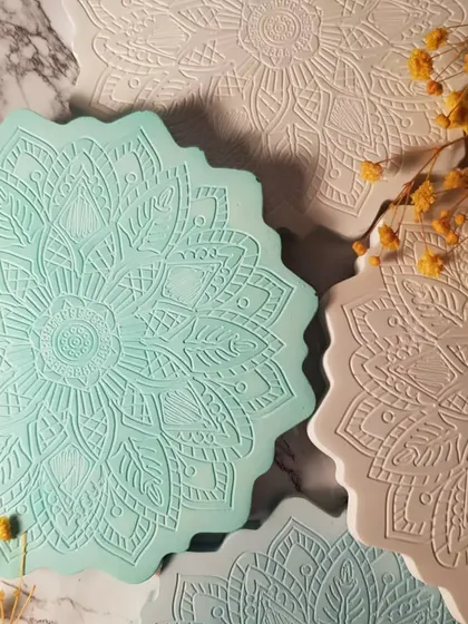 A set of four Mandala coasters in soft, complementary pastel shades. They make a beautiful and practical housewarming gift.