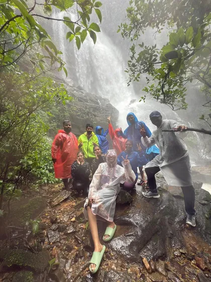 A happy moment with the group at a magnificent waterfall in Karnataka. We come as strangers but always leave as a family, sharing the joy of discovery.