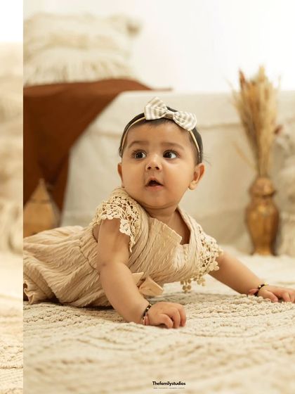 A beautiful profile of a baby during her tummy time. Sitter sessions are perfect for capturing these early milestones.