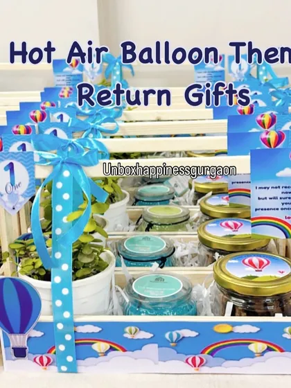 A full display of the 'Hot Air Balloon' themed return gifts, ready for a first birthday party.