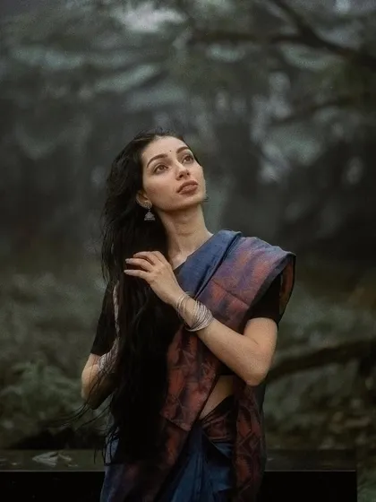 This portrait captures a thoughtful moment during our monsoon shoot. The natural setting and soft light create such a beautiful atmosphere.