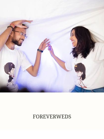 Adding a personal touch with matching cartoon t-shirts. This playful shot of Akash and Priya shows how small, fun details can make a pre-wedding shoot uniquely yours.